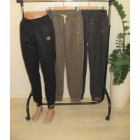 Жіночі штани на хутрі з кишенями на манжетах зі шкіряною емблемою різні кольори р.XL-5XL Kenalin